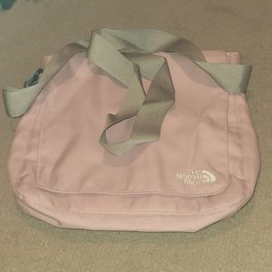 The North face cross body pink and gray purse.